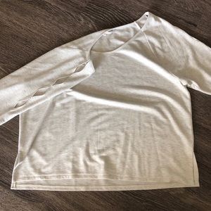 Long sleeve shirt with holes in sleeve
